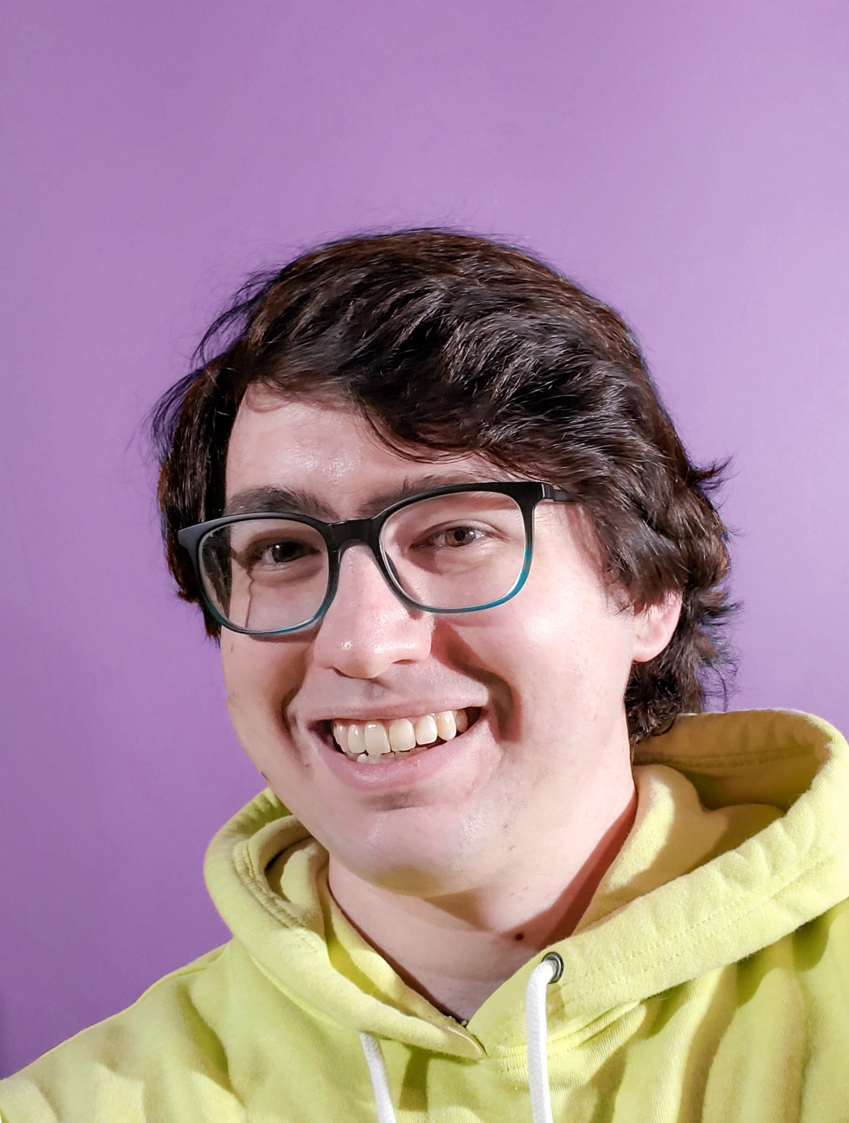 Image of Tyler in a yellow hoodie with a purple background.